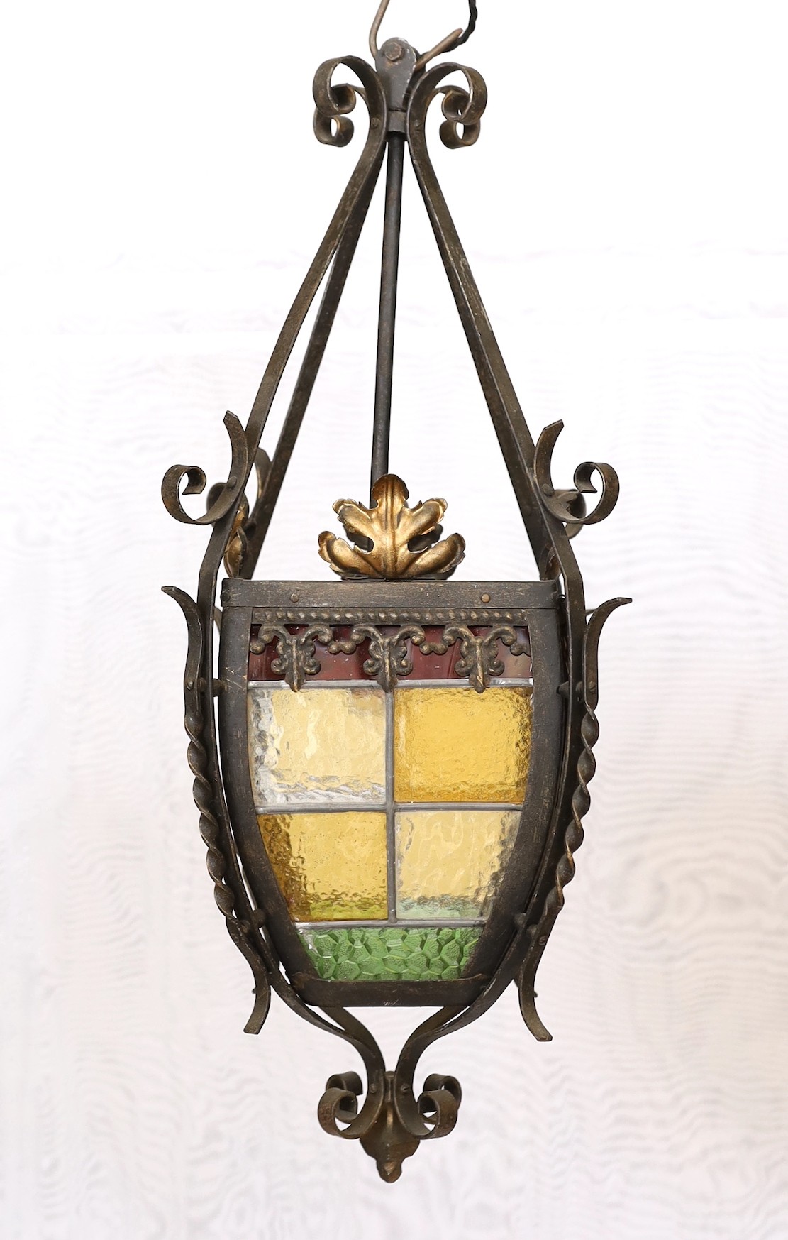 A 1940s-50s French wrought iron and stained glass hall lantern, height 60cm. width 28cm